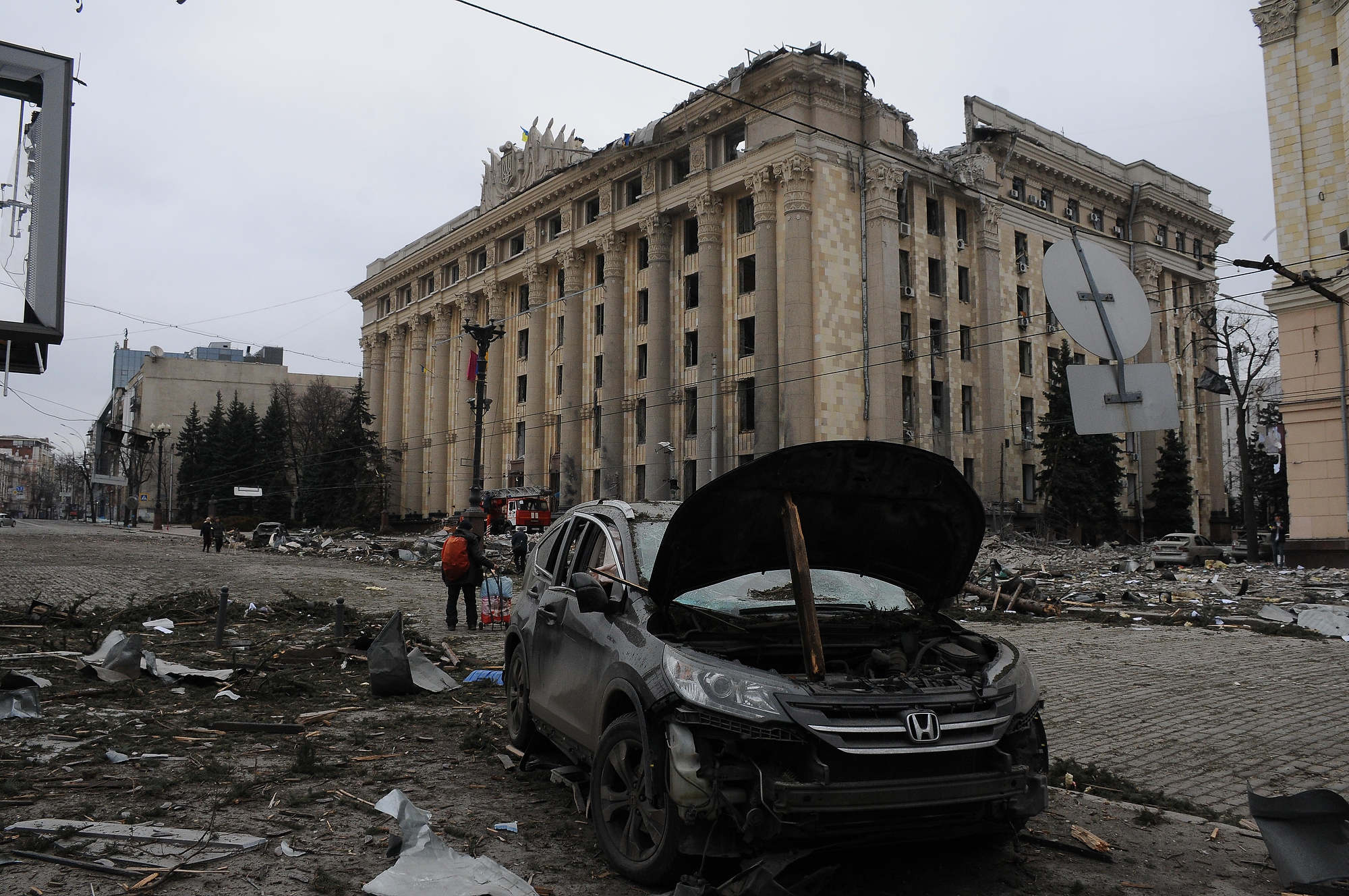 Russia inflicted a missile strike at the Freedom Square at the center of Kharkiv. This is one of the largest squares in Europe. State Emergency Service informed that there were hits in the building of the Kharkiv Oblast State Administration, the Opera House, the Philharmonic and part of the housing estate. Photo by Andriy Mariyenko, UNIAN. 1 March 2022. ~